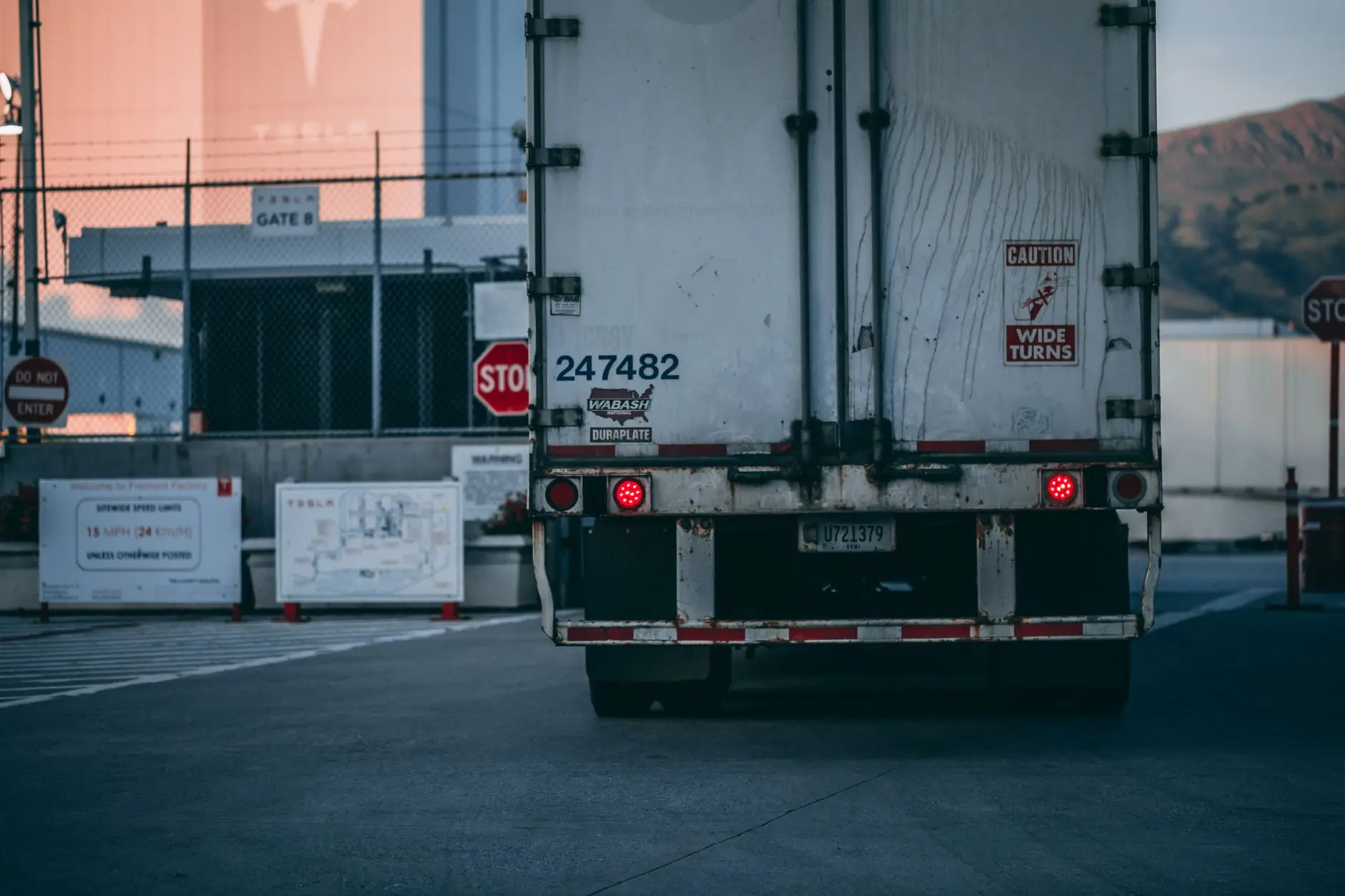 Rear of a semi trailer backed up to a loading dock