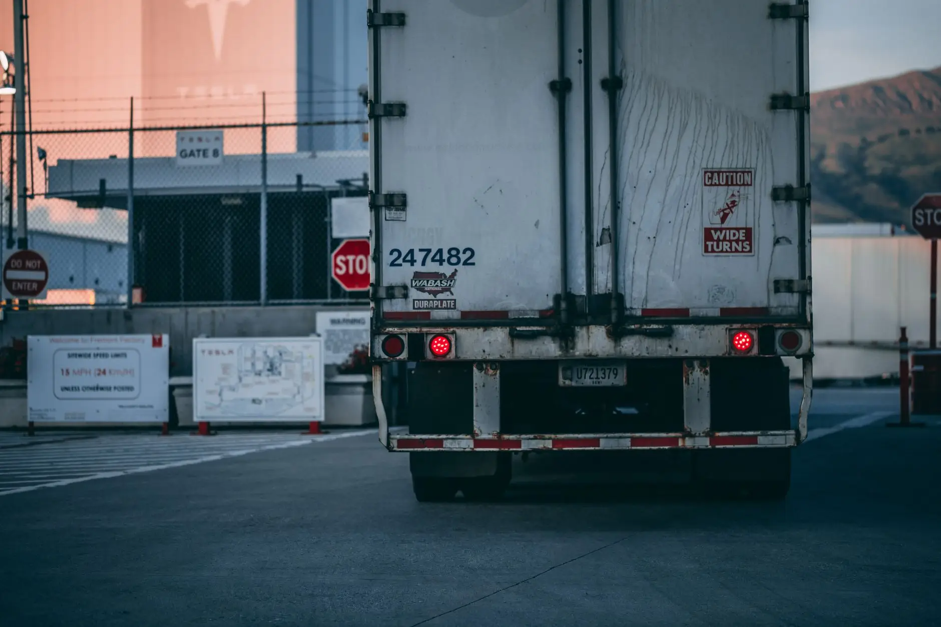 Rear of a semi trailer backed up to a loading dock